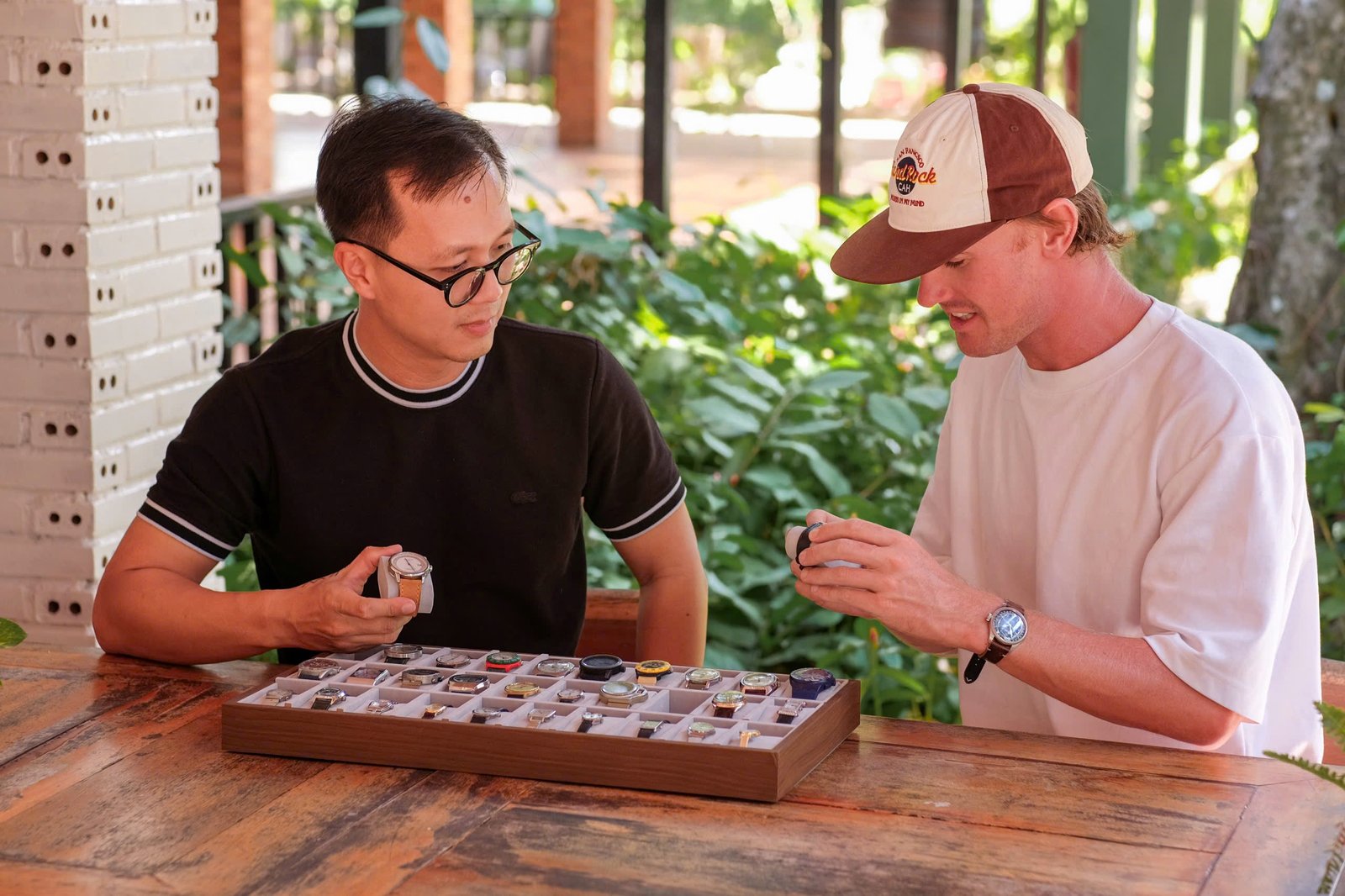 AMPM Vintage Watches — inspecting a tray of vintage watches before listing